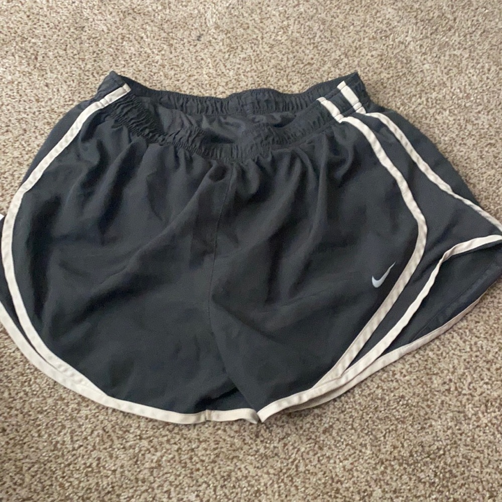 grey and white Nike shorts